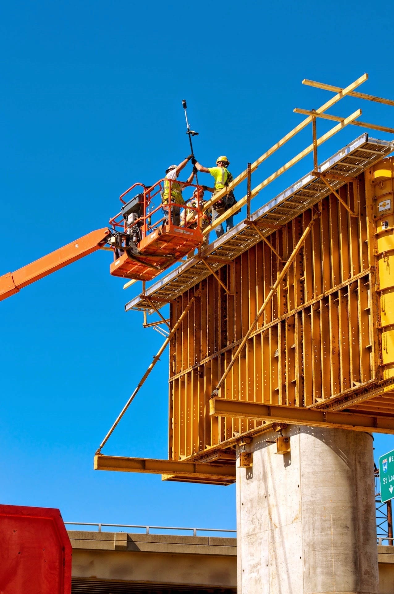OP3 Survey crew on a lift for roadway construction project